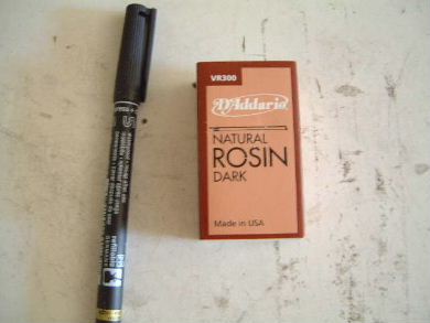 Natural Rosin, Dark - available at music stores for putting 
      on violin bow string.