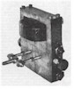 Used in receivers, this small mechanical and electrical oscillator provided a small AC current of constant frequency.